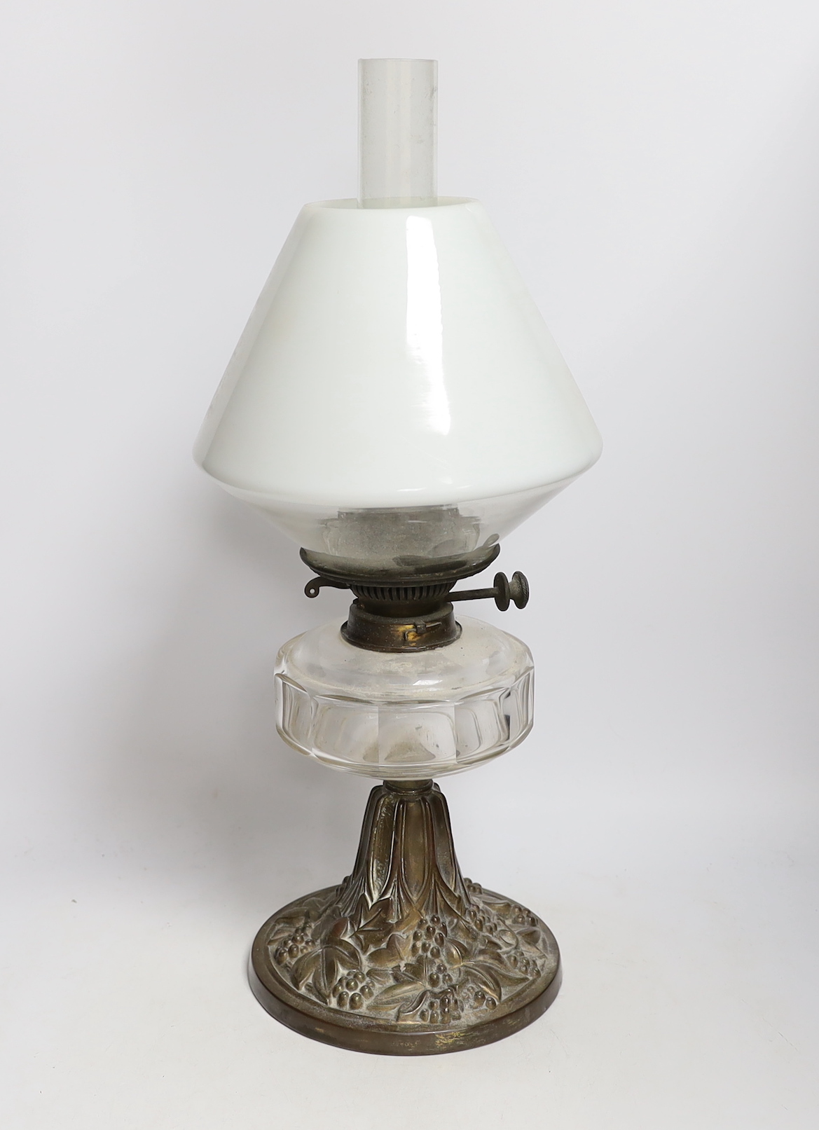 A Victorian brass stemmed oil lamp, with white glass shade, 54cm high including funnel